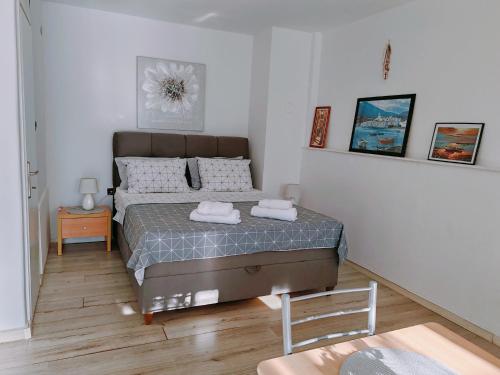 a bedroom with a bed with two towels on it at Marko apartment in Rovinj