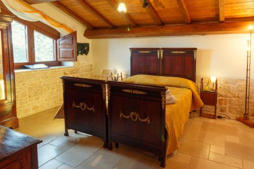 a bedroom with a bed and a sink in it at La Maison - Tenuta Colavecchio in Putignano
