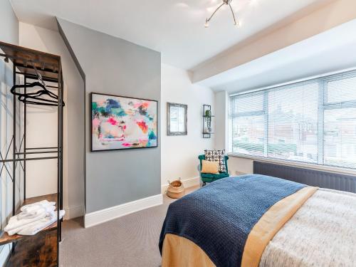 a bedroom with a bed and a window at 25 Appledore Gardens in Chester-le-Street