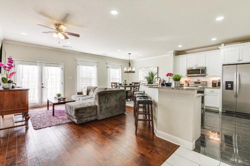 a kitchen and living room with a couch and a table at Family-Friendly FIFA World Cup Home Base! in Grand Prairie