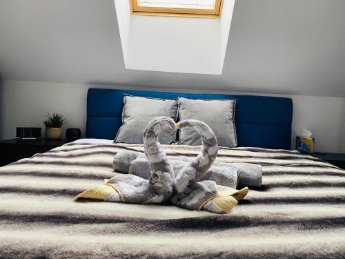 Ένα ή περισσότερα κρεβάτια σε δωμάτιο στο Apartament Masuria SPA Renata Rosłoń