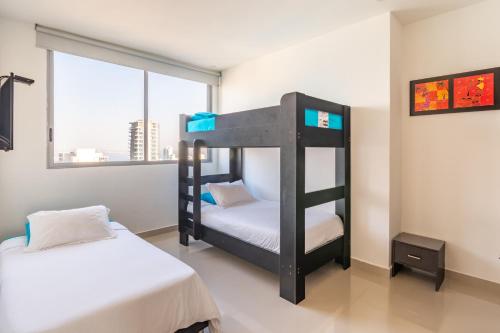 Postel nebo postele na pokoji v ubytování 41st Fl Beach Condo in Bocagrande