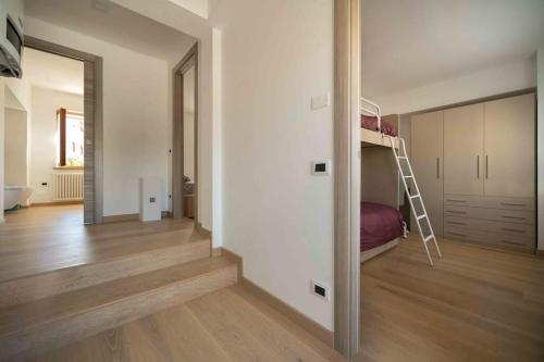 a room with a bedroom with a bunk bed at Da Elda in Belluno