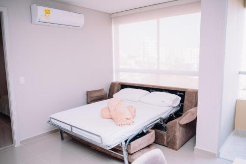 a hospital bed in a room with a window at Apartaestudio Luxur en Barranquilla in Barranquilla