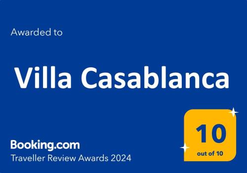 una señal que lee Villa Casablanca con una caja amarilla en 10 Bedroom 5 Star Luxury Villa & Heated Pool for 5 to 30 Guests near Alicante en Mutxamel