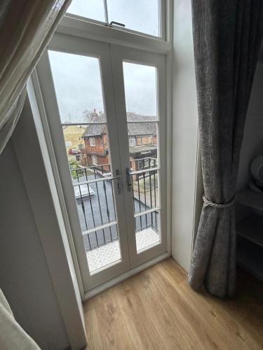 an open door with a view of a balcony at Number 8 in Canterbury