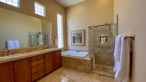 a large bathroom with a shower and a sink at TEE TIME: 2 bed + convertible den; private pool and spa, VIEWS! A Greenday property. in Rancho Mirage