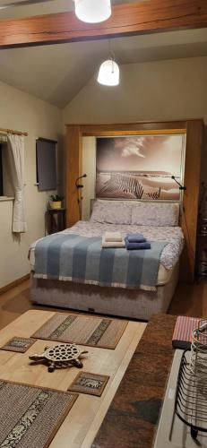 a bedroom with a large bed in a room at The Stable, Bennettsbridge, Kilkenny in Bennettsbridge