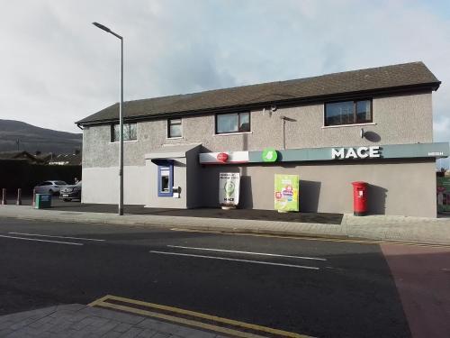 a building on the side of a street at Johnny Murphy's Guest Rooms in Meigh