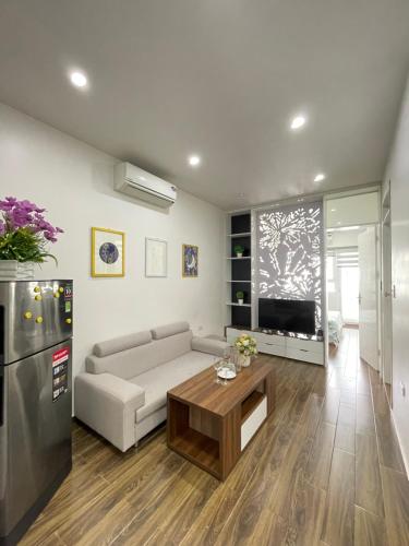 a living room with a couch and a table at DK APARTMENT in Hai Phong