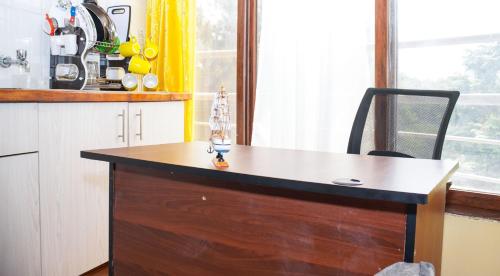 Η κουζίνα ή μικρή κουζίνα στο Supercilious Suite Apartment