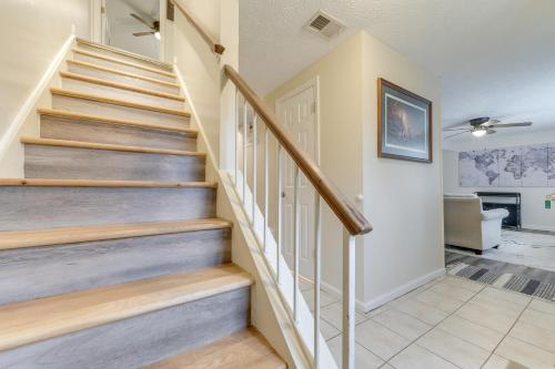a staircase in a home with wooden steps at Quiet Vacation Rental in Peachtree City with Yard! in Peachtree City