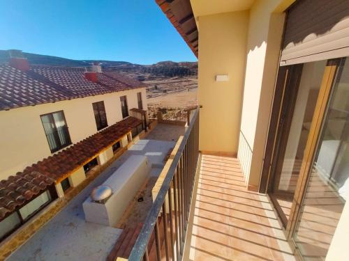 a balcony of a house with a view of the desert at Casa ELENA i MARTA , Valdelinares in Valdelinares