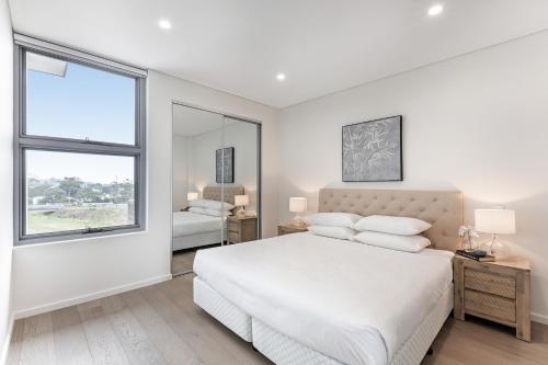 Ένα ή περισσότερα κρεβάτια σε δωμάτιο στο 3-Bed Apartment in Beautiful Kiama with Study Nook