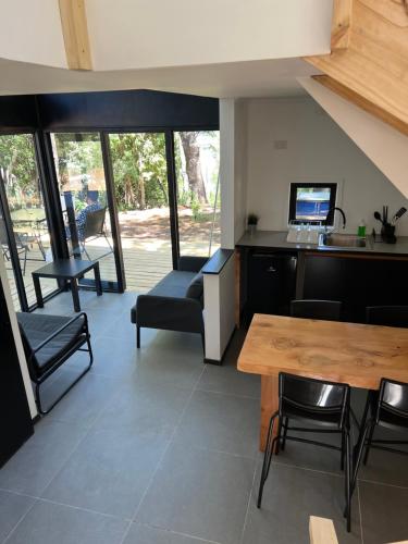 a living room with a couch and a table at Tiny house en bosque nativo camino a Termas de Chillan in Recinto