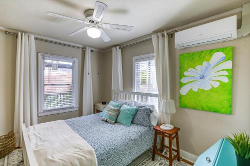 a bedroom with a bed and a ceiling fan at Charming Bungalow Near LA Waterfront and Beaches in San Pedro
