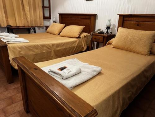 Ένα ή περισσότερα κρεβάτια σε δωμάτιο στο Hotel Colonial
