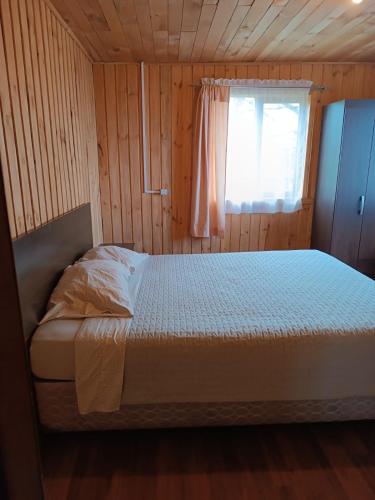 Giường trong phòng chung tại Cabañas Don Agustín
