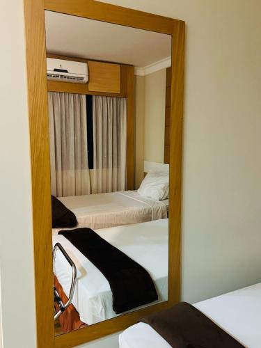 Katil atau katil-katil dalam bilik di Quarto de hotel de luxo Congonhas
