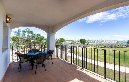 a patio with a table and chairs on a balcony at Nice Apartment In Sucina With Wifi in Sucina