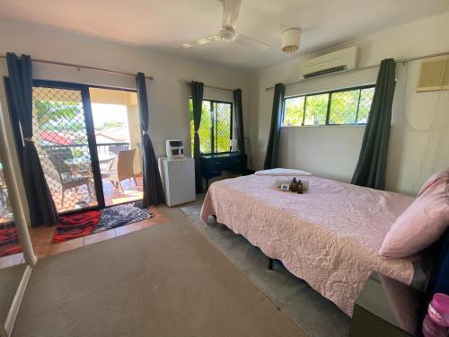 a bedroom with a bed and a large window at Master Ensuite and private balcony in White Rock