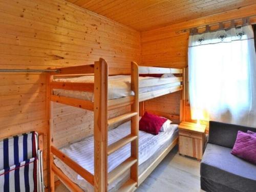 a bedroom with two bunk beds in a cabin at Cozy holiday home, Siano ty in Sianozety