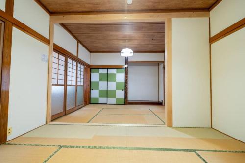 an empty room with a japanese room at Seaside House Nagi in Itoigawa