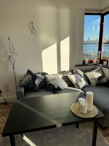 a living room with a couch and a coffee table at Perfect in the centre with view in London