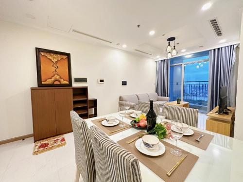 a dining room with a table and chairs at 2 Bedrooms in Landmark area in Ho Chi Minh City