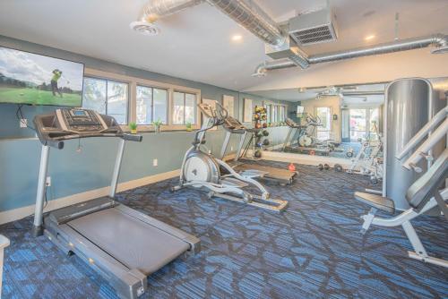 a gym with several exercise equipment in a room at 2BR near Stone Creek - Pool & Mall Access Comfort - C254 in Phoenix