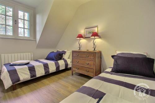 Postel nebo postele na pokoji v ubytování Du corps de garde