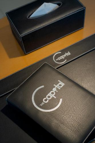 a black box with a coke logo on it at The Capital Hotel Surabaya in Surabaya
