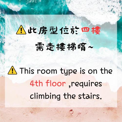 a sign with chinese writing on a beach at 華納小筑 in Kenting