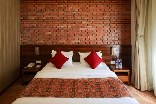 Ein Bett oder Betten in einem Zimmer der Unterkunft Hotel Dolmaling