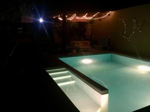 a swimming pool in a house at night at Casa Buganbilia in San Sebastián Etla