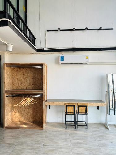 two chairs sitting next to a table in a room at Chubby 9 in Bang O