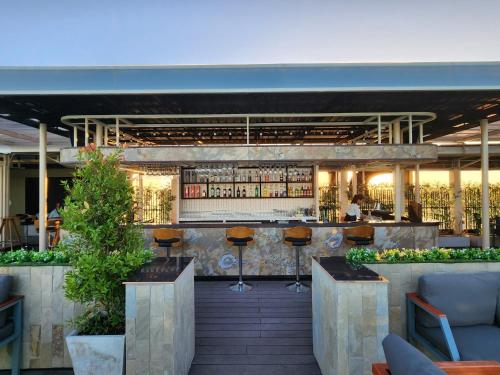 a bar on the roof of a building at Blu Hotel in Nakhon Phanom