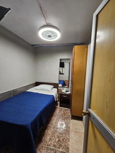 Postel nebo postele na pokoji v ubytování Hostal Arica 3
