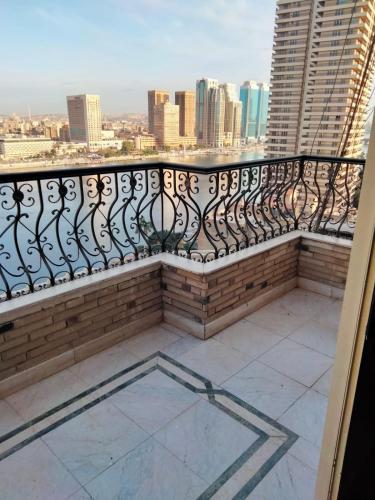 a balcony with a view of the city at شقة الزمالك علي النيل حي السفارات in Cairo