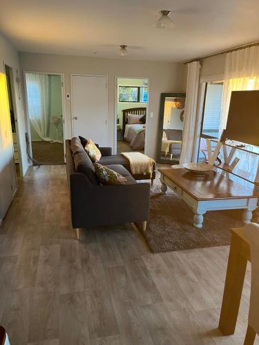 a living room with a couch and a coffee table at Cozy corner in Thames