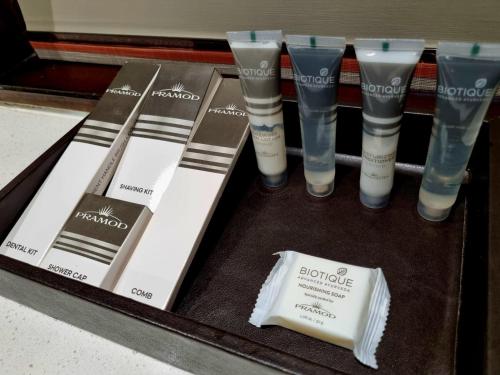 a display of different types of shower products on a shelf at Pramod Convention & Club Resort in Cuttack