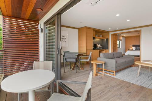a living room with a couch and a table at SA Carbon Beach Suites in Malibu