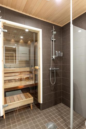 a bathroom with a shower and a walk in shower at Starvillas B302 in Kalajoki