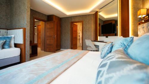 Katil atau katil-katil dalam bilik di Vela Verde Hotel & SPA