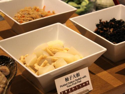a group of bowls of food on a table at APA Hotel Tottori Ekimae Minami in Tottori