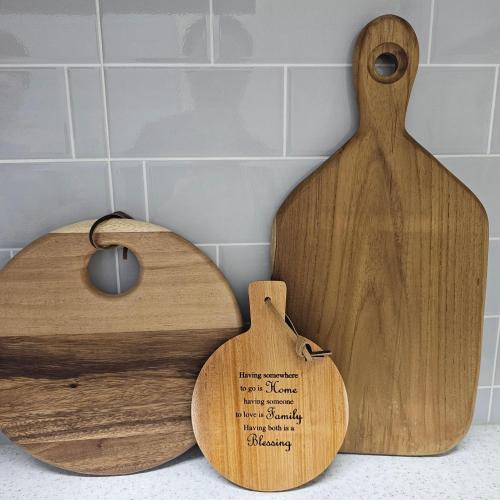 two wooden cutting boards sitting on top of a counter at Soban Stay in Busan