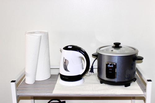 a toaster and a roll of toilet paper on a shelf at La Vida Hermosa in Manila