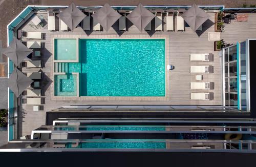 an overhead view of a swimming pool in a building at Aqua Hotel in Rimini