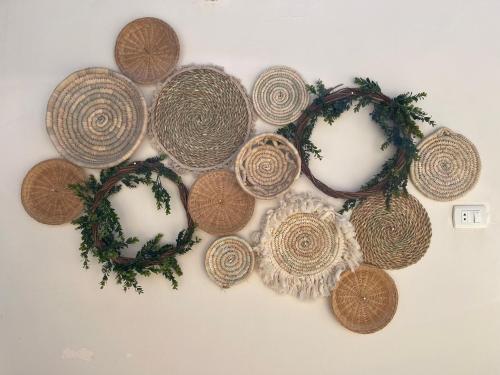 a bunch of coins on a table with a wreath at La Casa Budget in Marsa Alam City