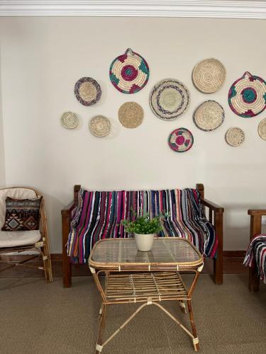 a room with a table and plates on the wall at La Casa Budget in Marsa Alam City